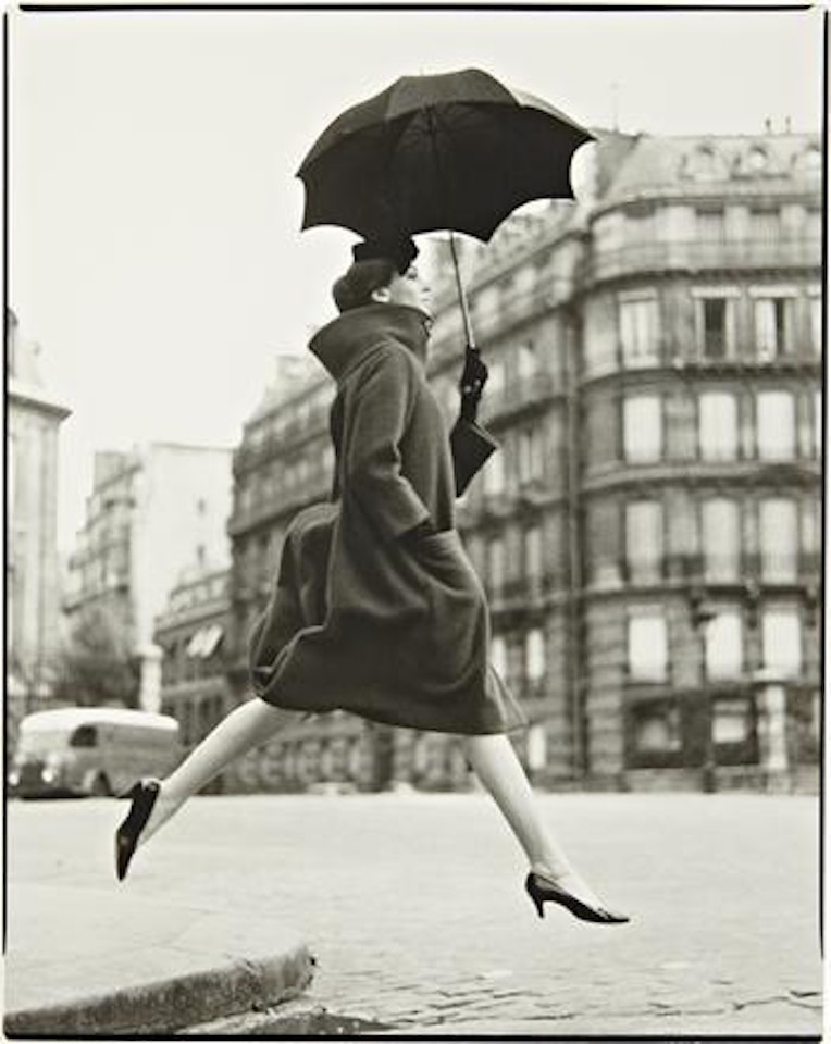 Homage to Munkacsi. Carmen, model. Coat by Cardin. Place François 1er, Paris, August, 1957 by Richard Avedon