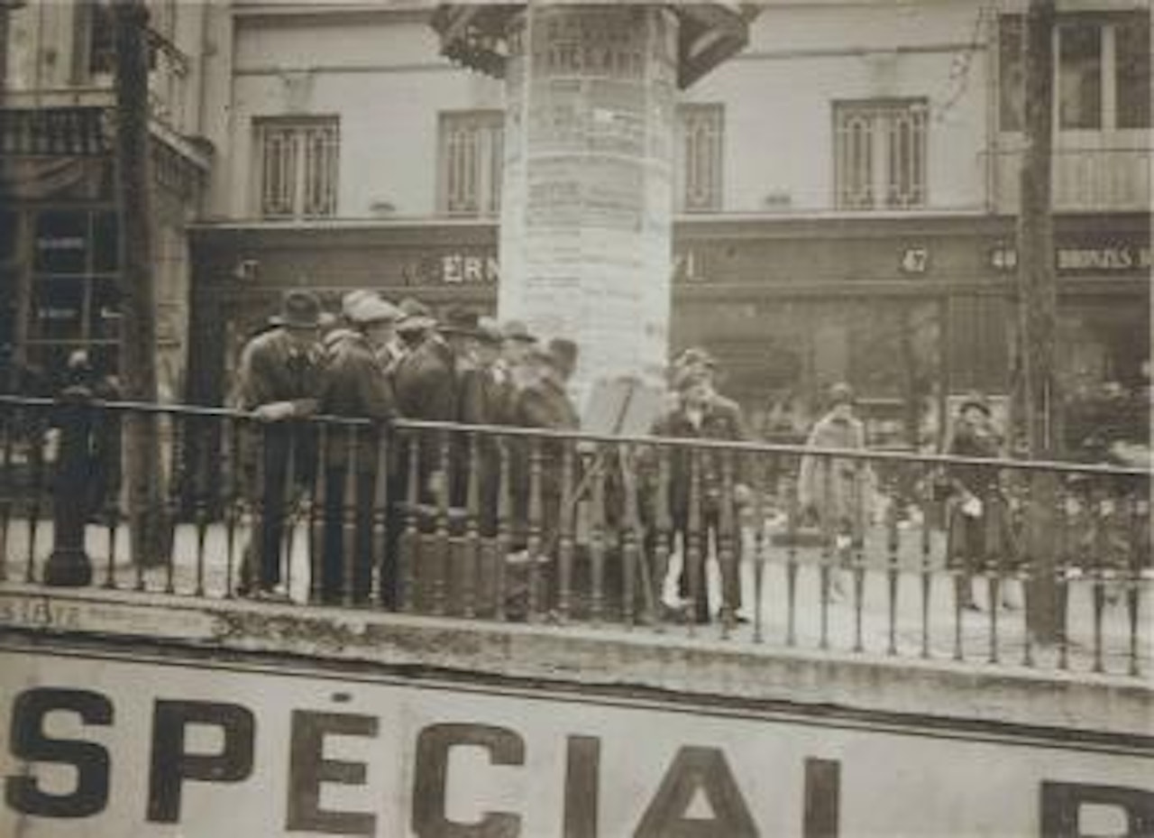 Street artist near the Porte St. Denis by André Kertész