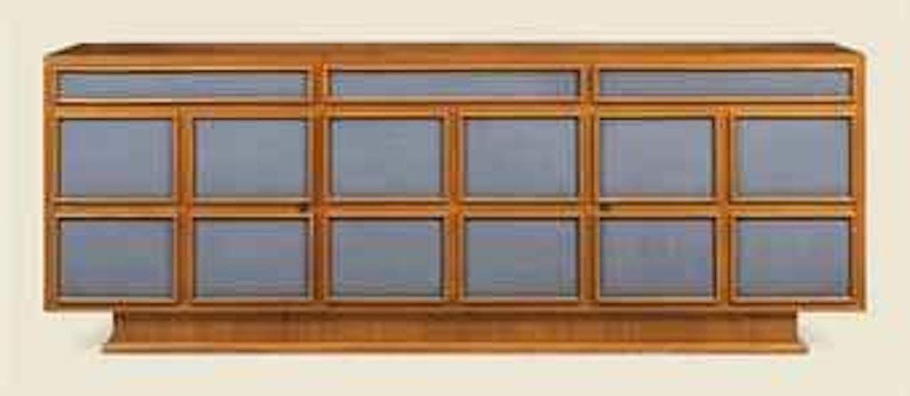 An Oak and Naugahyde Sideboard by Jean Royere