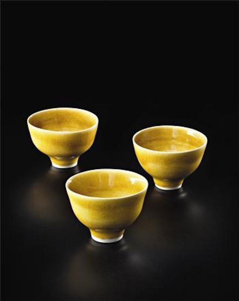 Set of three small yellow bowls by Lucie Rie