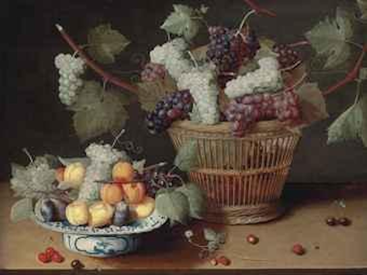 Grapes, peaches and plums on a Delft platter and grapes in a woven basket, with strawberries, cherries and a fly on a stone ledge by Isaak Soreau