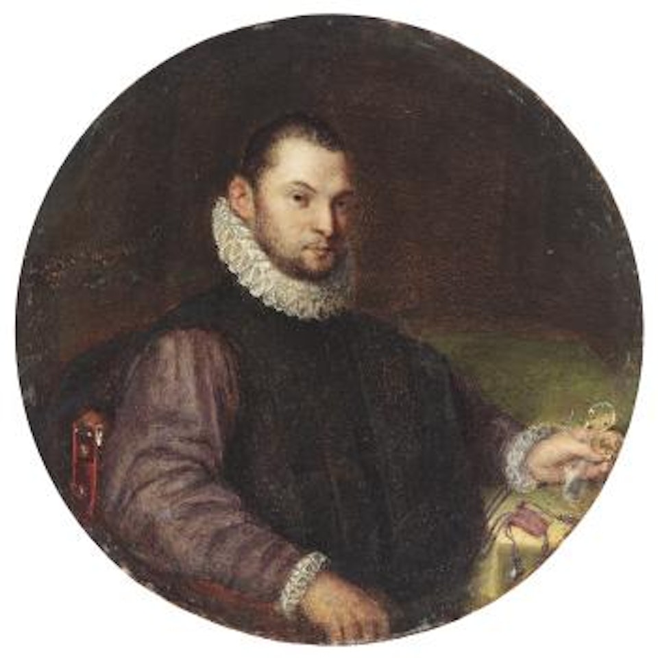 Portrait of a young man, half-length, seated at a table and holding an object in his left hand by Lavinia Fontana