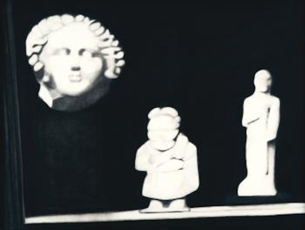 Untitled (Head And Figurines On Shelf, Consulting Room, 1938) by Robert Longo