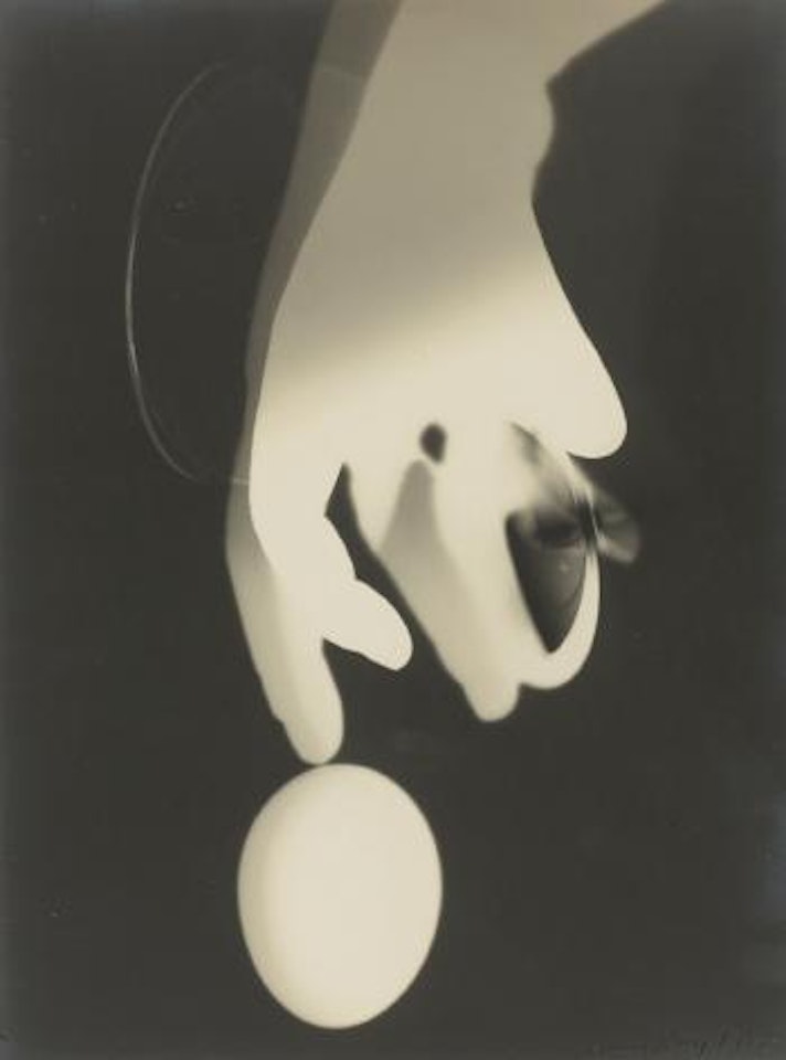 Rayograph With Hand, Lens, And Egg by Man Ray