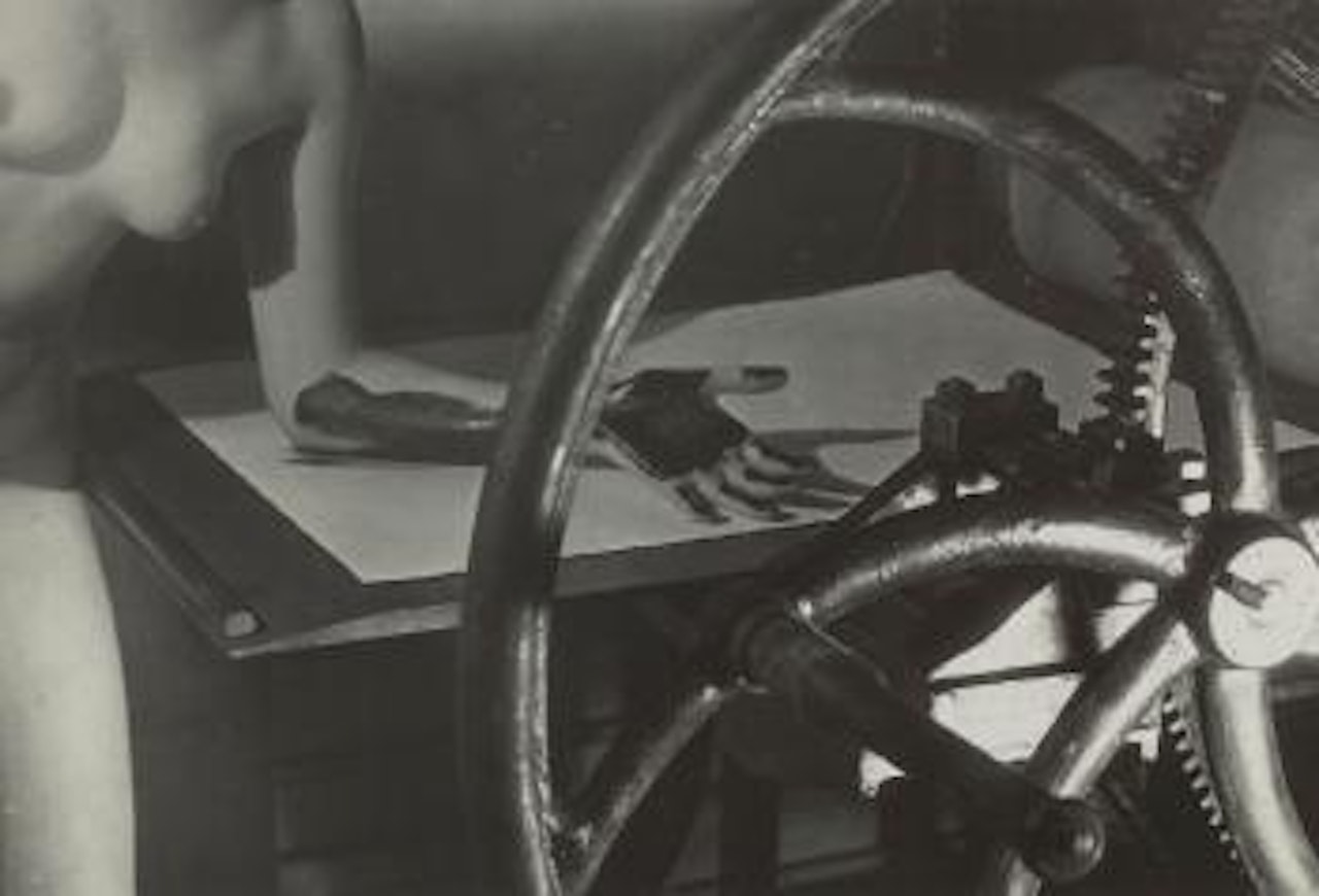Meret Oppenheim At The Printing Wheel by Man Ray