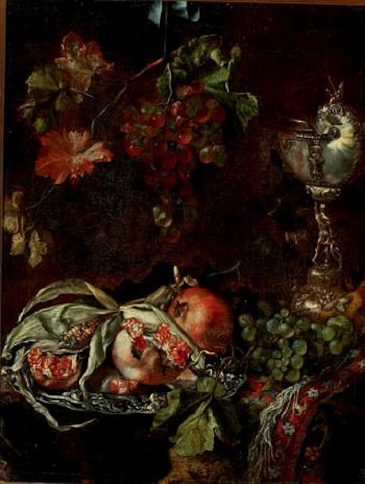 Still life with pomegranates and corn placed in a silver dish, nautilus shell mounted with silver and a bunch of fresh grapes by Dutch School