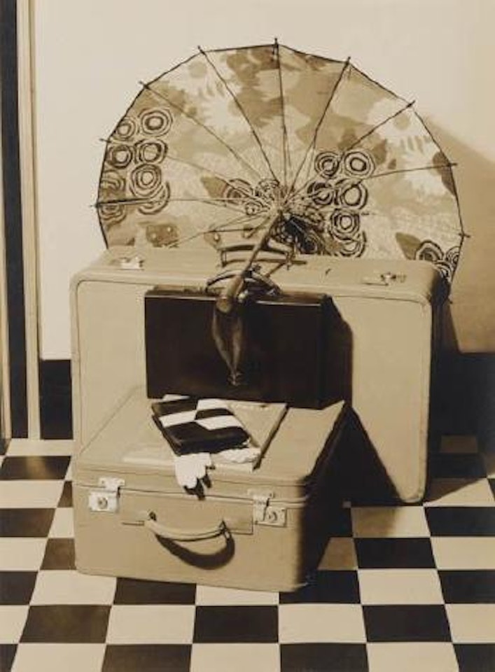 Still life with suitcases and an umbrella by Paul Outerbridge
