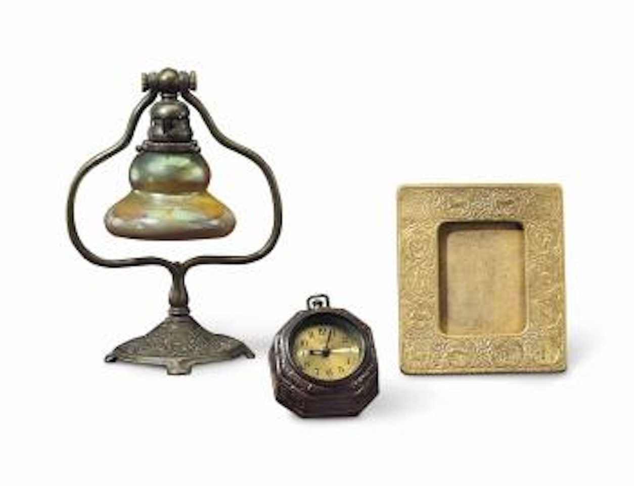 A Group Of Desk Articles In The 'Zodiac' Pattern by Tiffany Studios