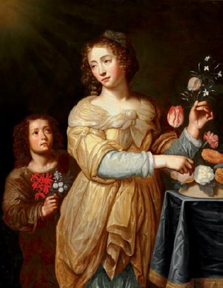 Elegant young woman arranging flowers in a basket, a young boy is watching by Flemish School