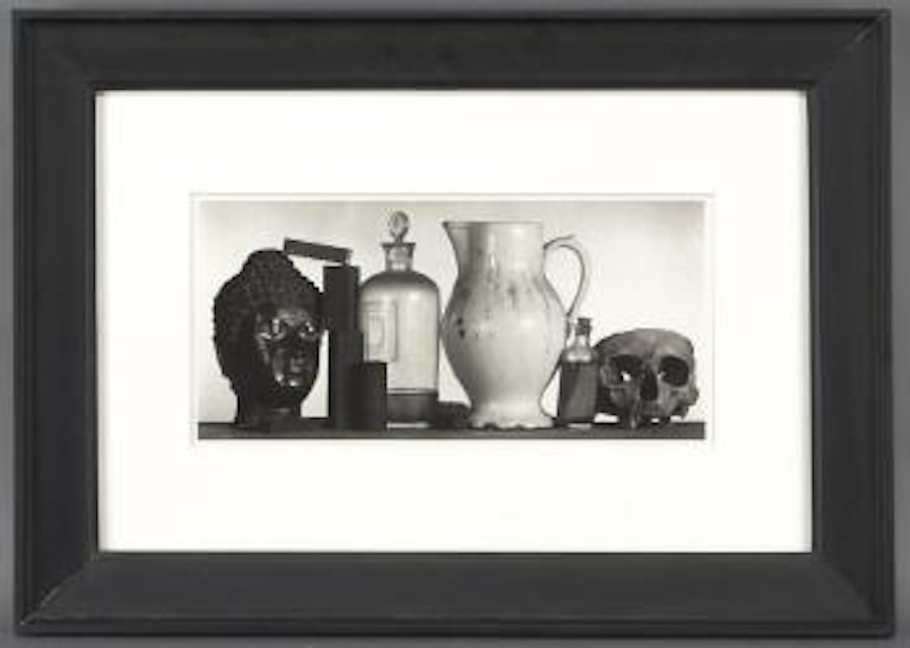Still life with skull, pitcher and medicine bottle by Irving Penn