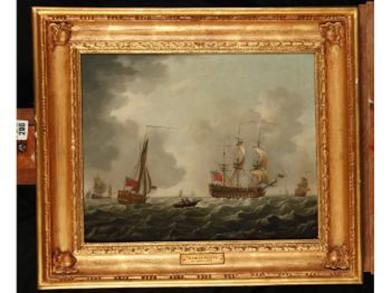 Shipping becalmed and a man-o-war firing a salute. Shipping in a breeze off the coast by Francis Swaine