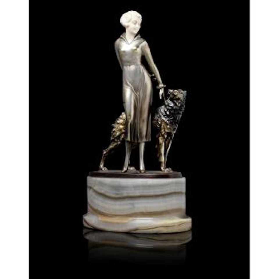 Young woman in high collared dress and high heels standing with an Afghan Hound by Josef Lorenzl