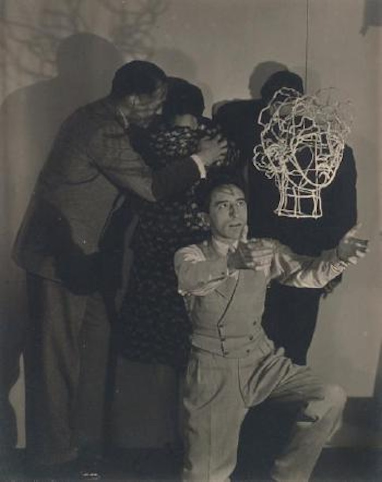 Jean Cocteau et la sculpture "Débourre-pipes" avec Marie-Laure, Charles de Noailles et Georges Auric by Man Ray