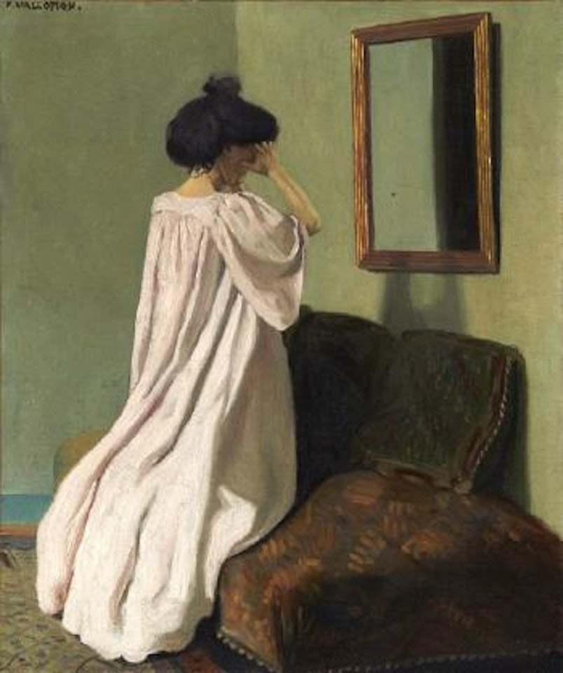 Gabrielle Vallotton agenouillée devant une glace sur le divan de l'atelier de la rue des Belles-feuilles by Félix Vallotton