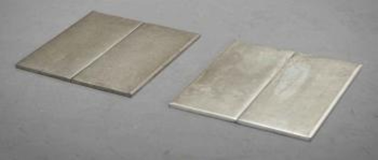 Tin Inside-Outside Bipair by Carl Andre