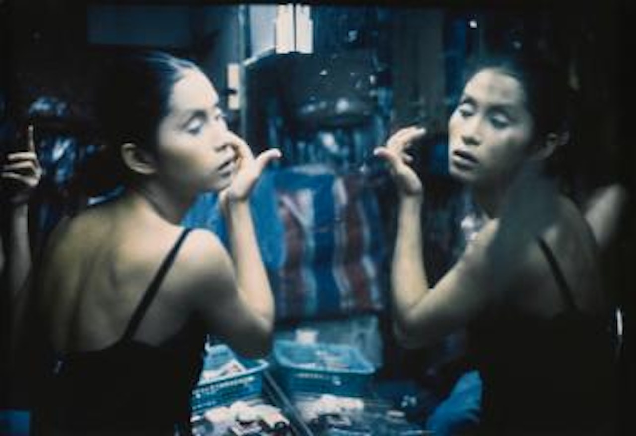 C putting on her make-up at second tip, Bangkok by Nan Goldin