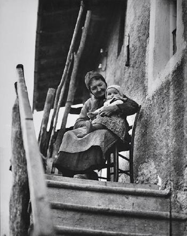 Portrait of an old woman and her young charge in Savoy by André Kertész