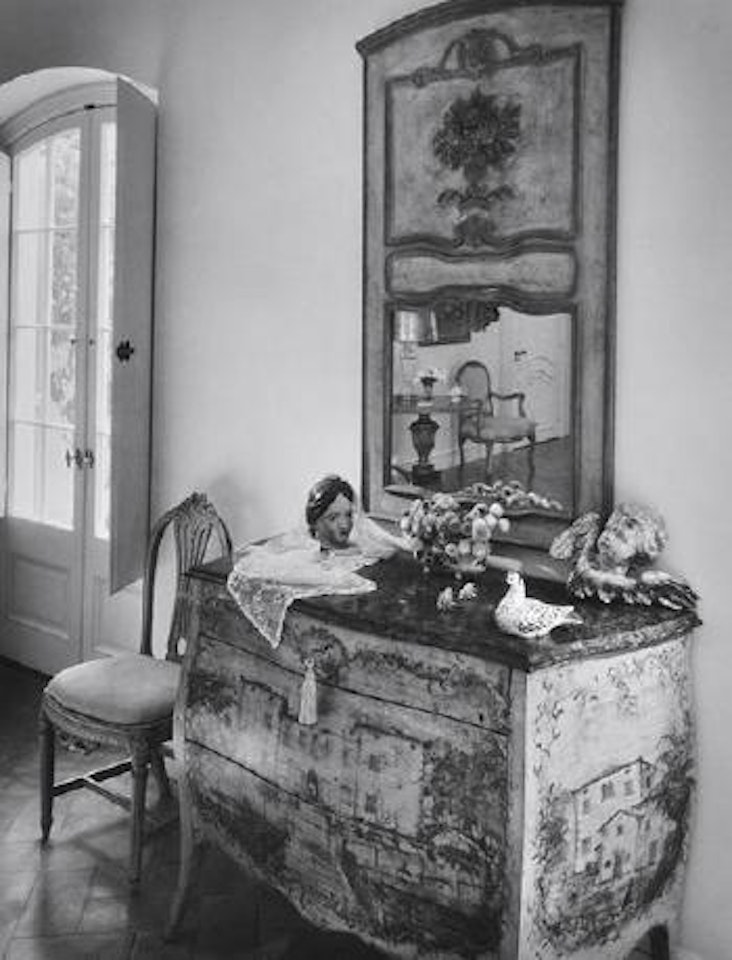 Untitled (Still life on painted bureau) by André Kertész