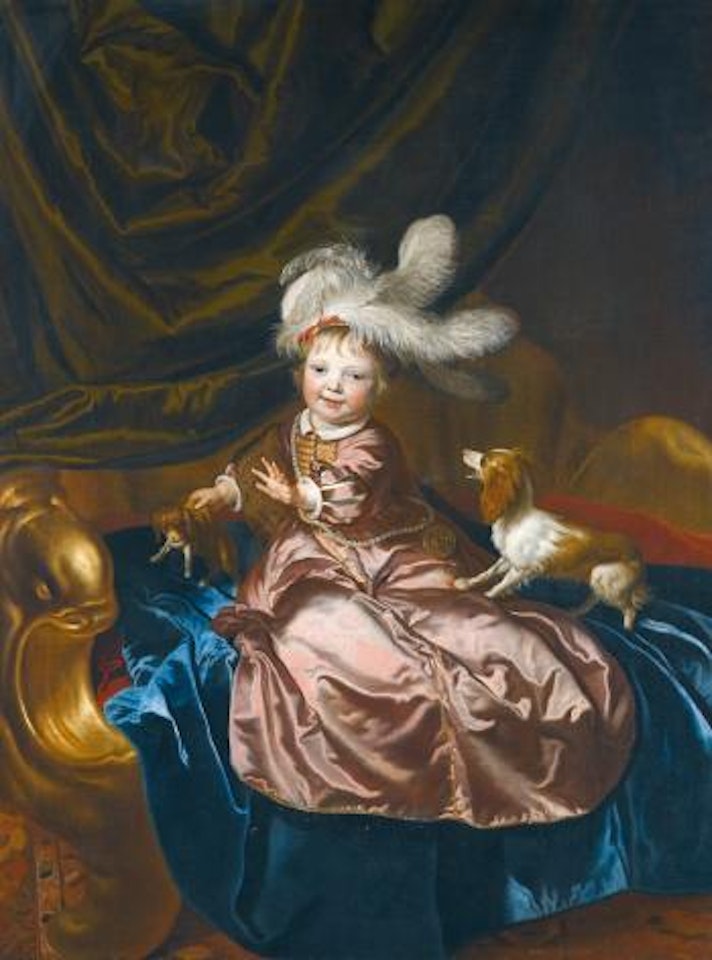 Portrait of a boy, full length, in pink silk playing with two puppies by Jacob van Loo