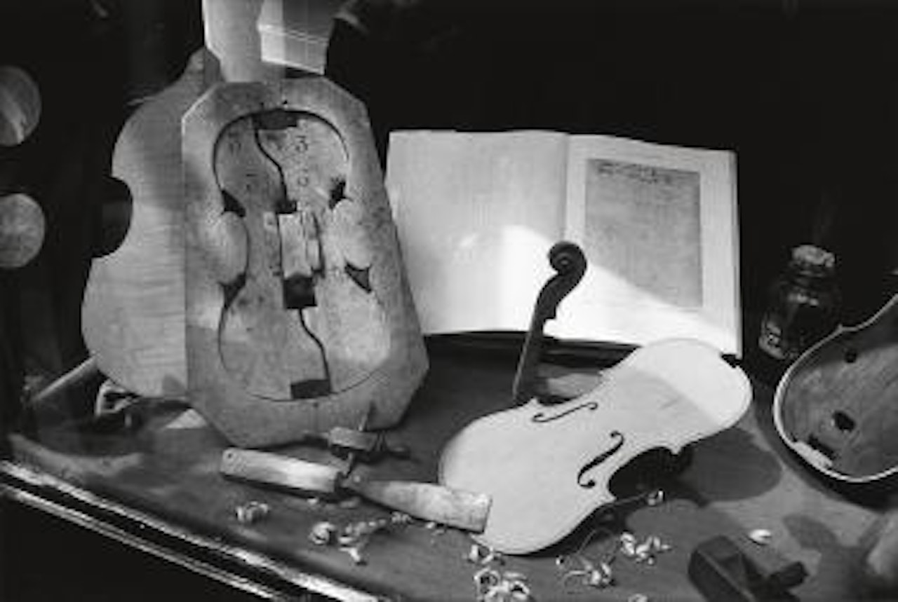Violin shop by André Kertész