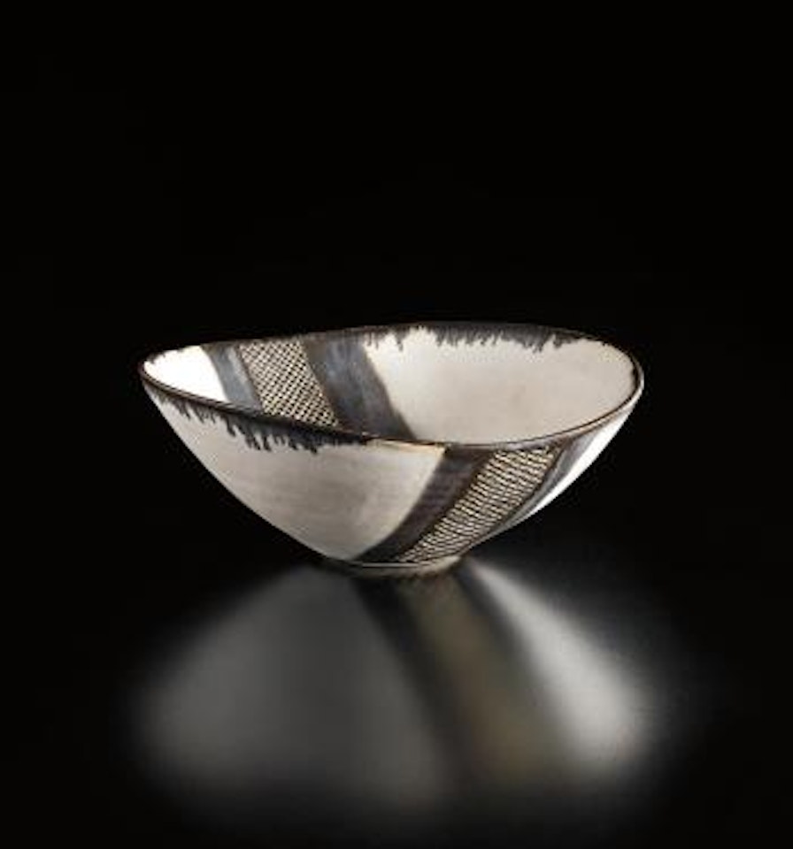 White oval bowl with gold band by Lucie Rie