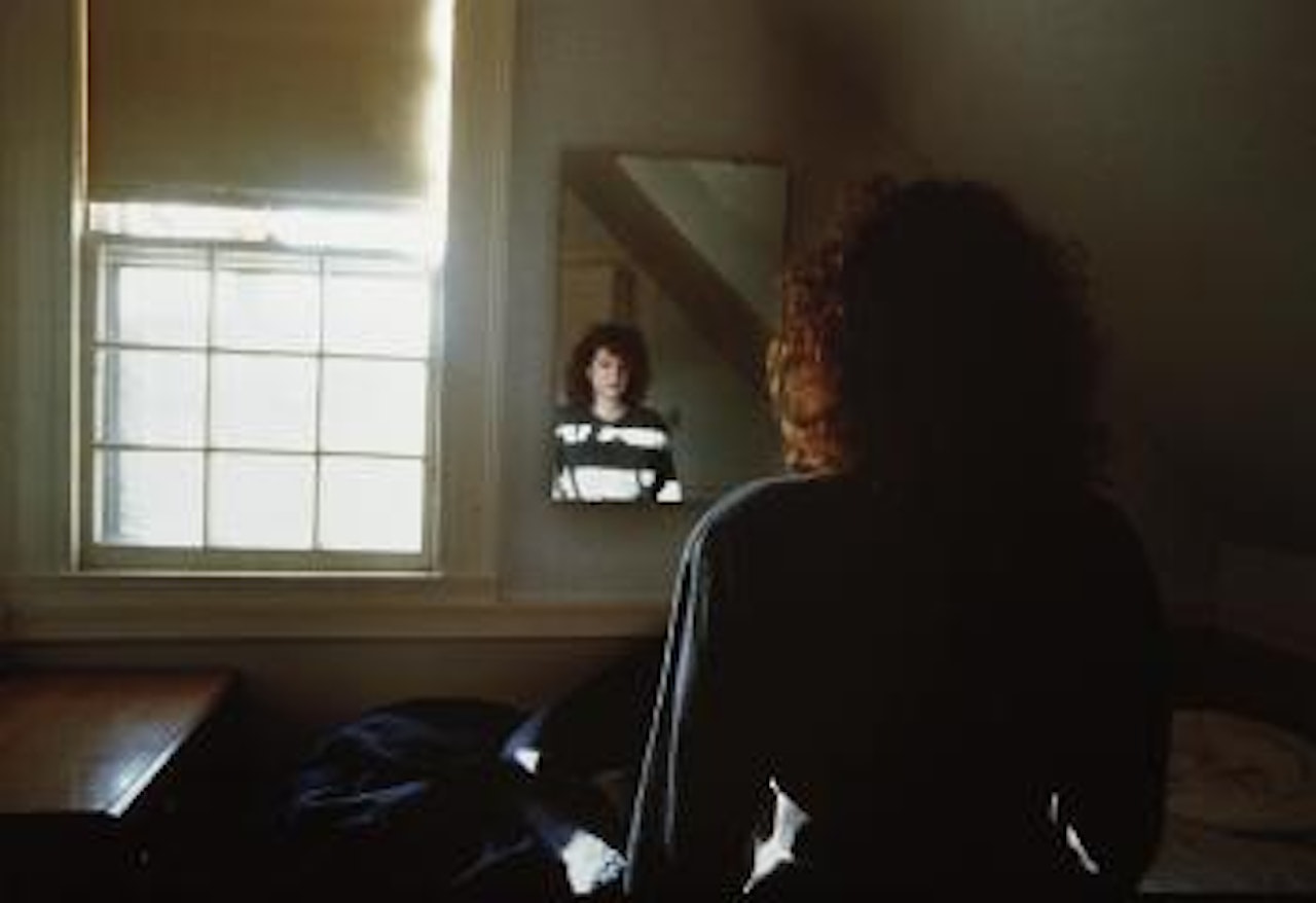 Self-portrait in the mirror, The Lodge, 1988 by Nan Goldin