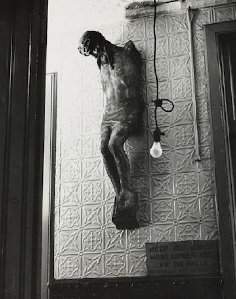 Christ and lightbulb, New York by André Kertész