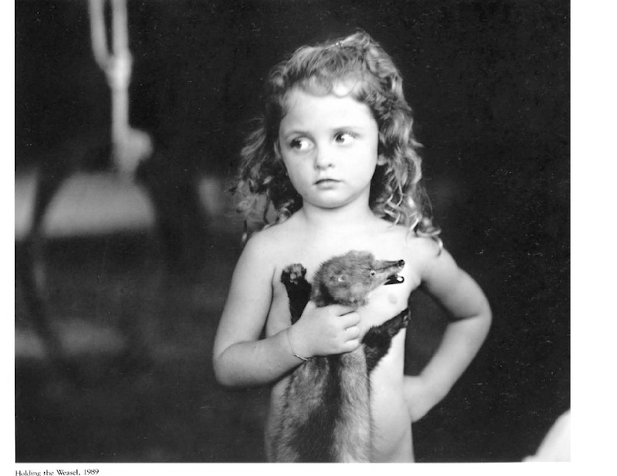 'HOLDING THE WEASEL' by Sally Mann
