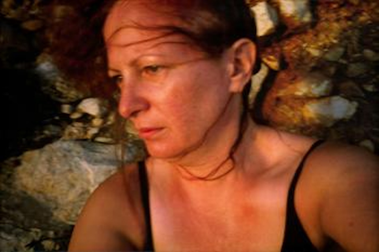 Self Portrait On The Rocks, Levanzo, Sicily by Nan Goldin