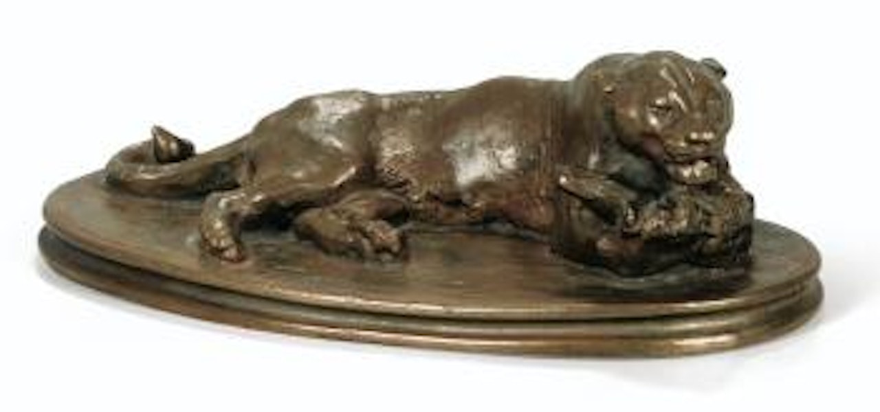 Jaguar couché tenant une tête de cheval by Antoine-Louis Barye