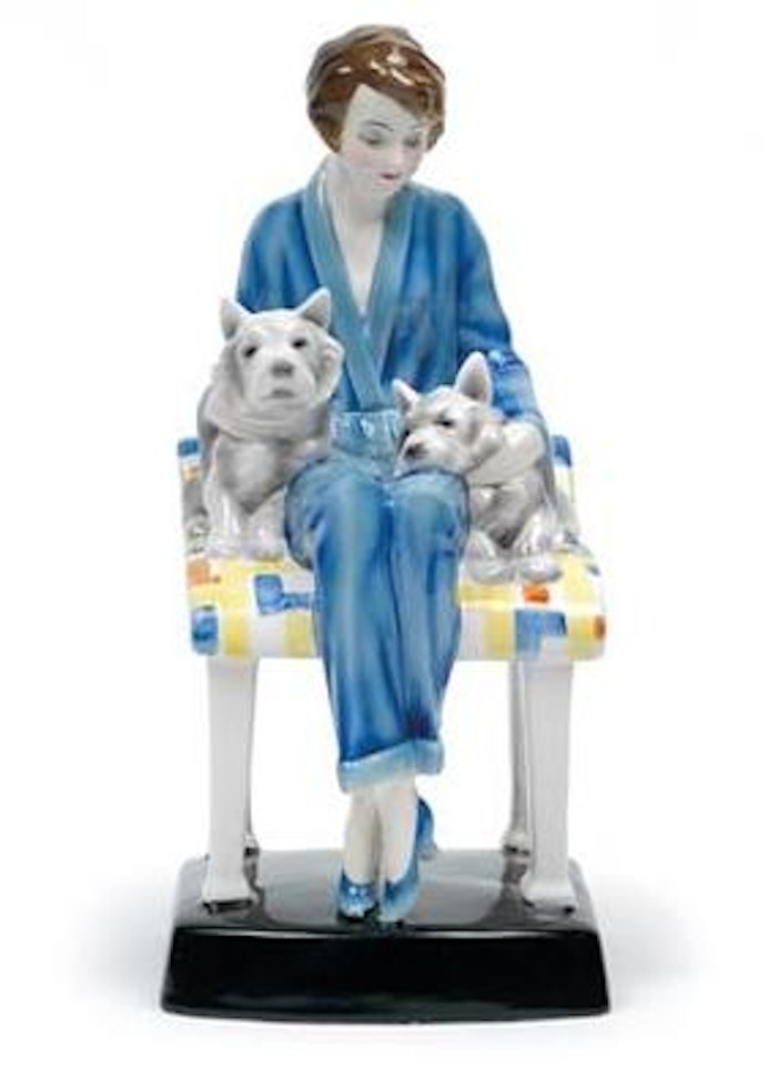 A seated girl in pyjamas and two dogs by Josef Lorenzl