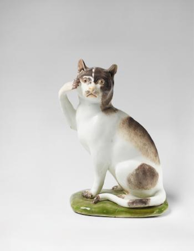 A cat on an earth mound base by Johann Joachim Kändler