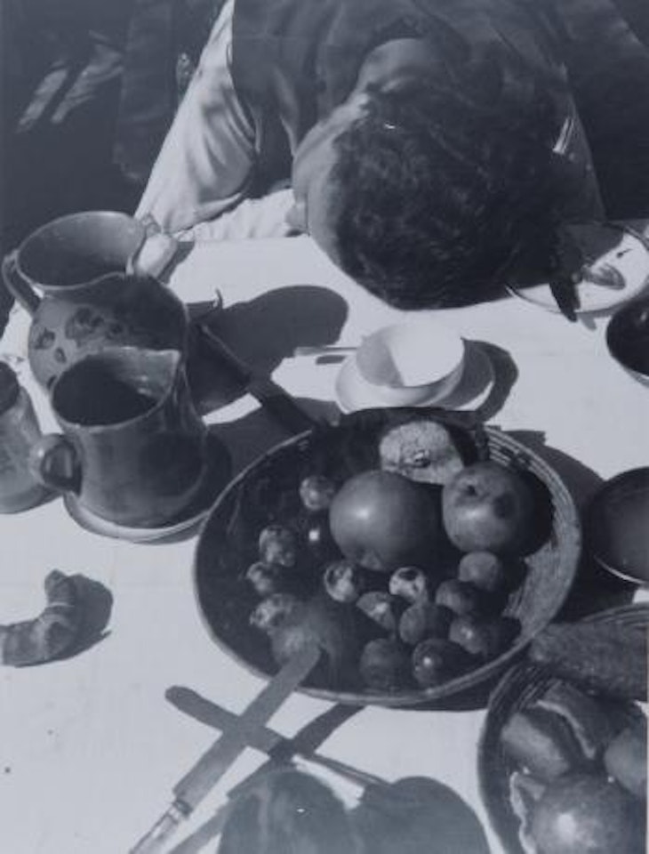 Lucia Moholy am Fruehstueckstisch by László Moholy-Nagy