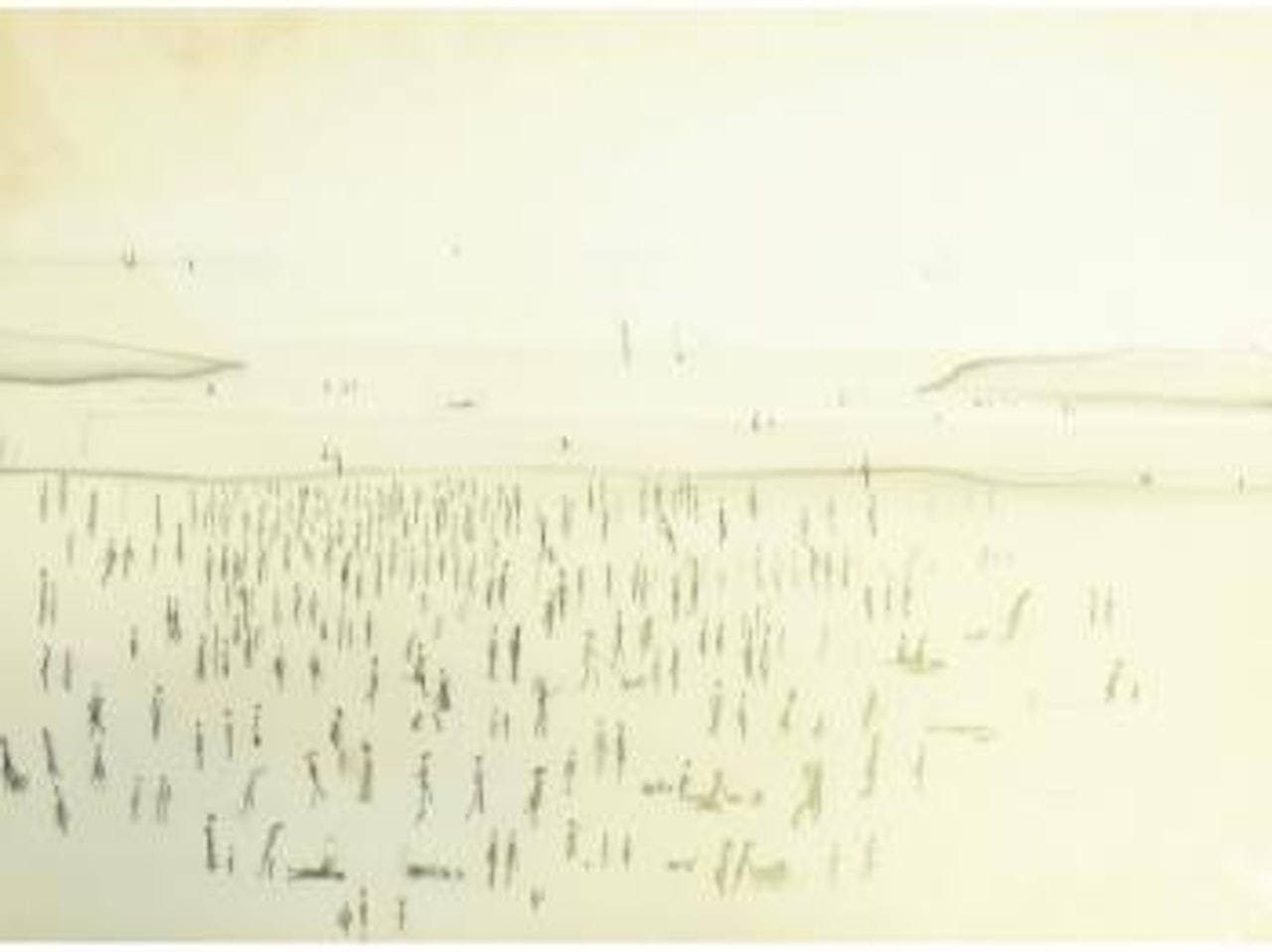 Beach scene with figures by Laurence Stephen Lowry