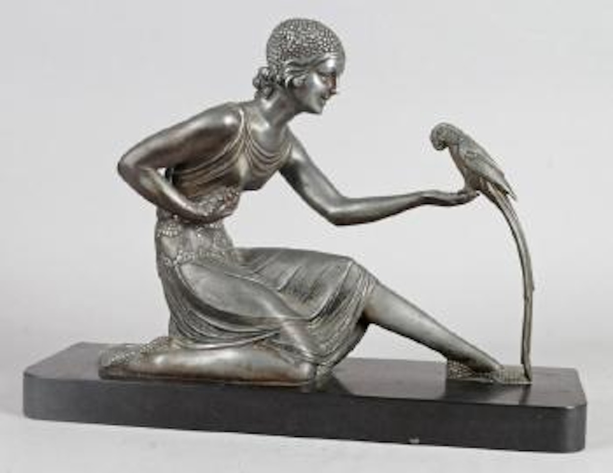 Jeune femme au perroquet by Demetre Chiparus