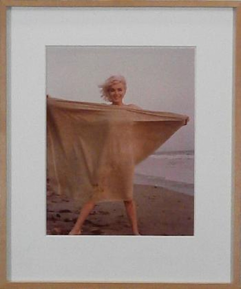Marilyn Monroe, on the beach with towel by George Barris