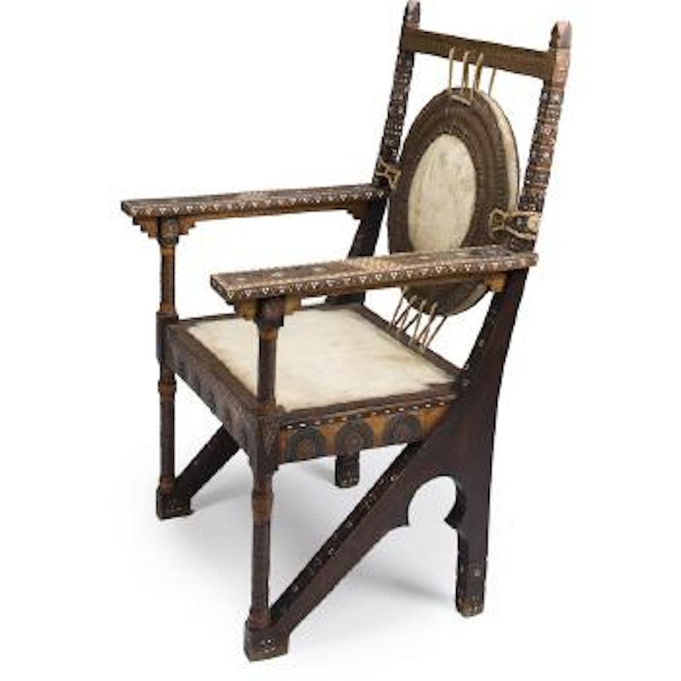 An inlaid armchair by Carlo Bugatti
