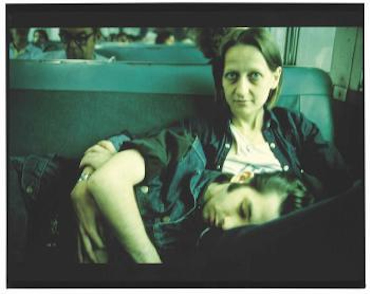Suzanne and Philippe on the Train, Long Island, 1985 by Nan Goldin