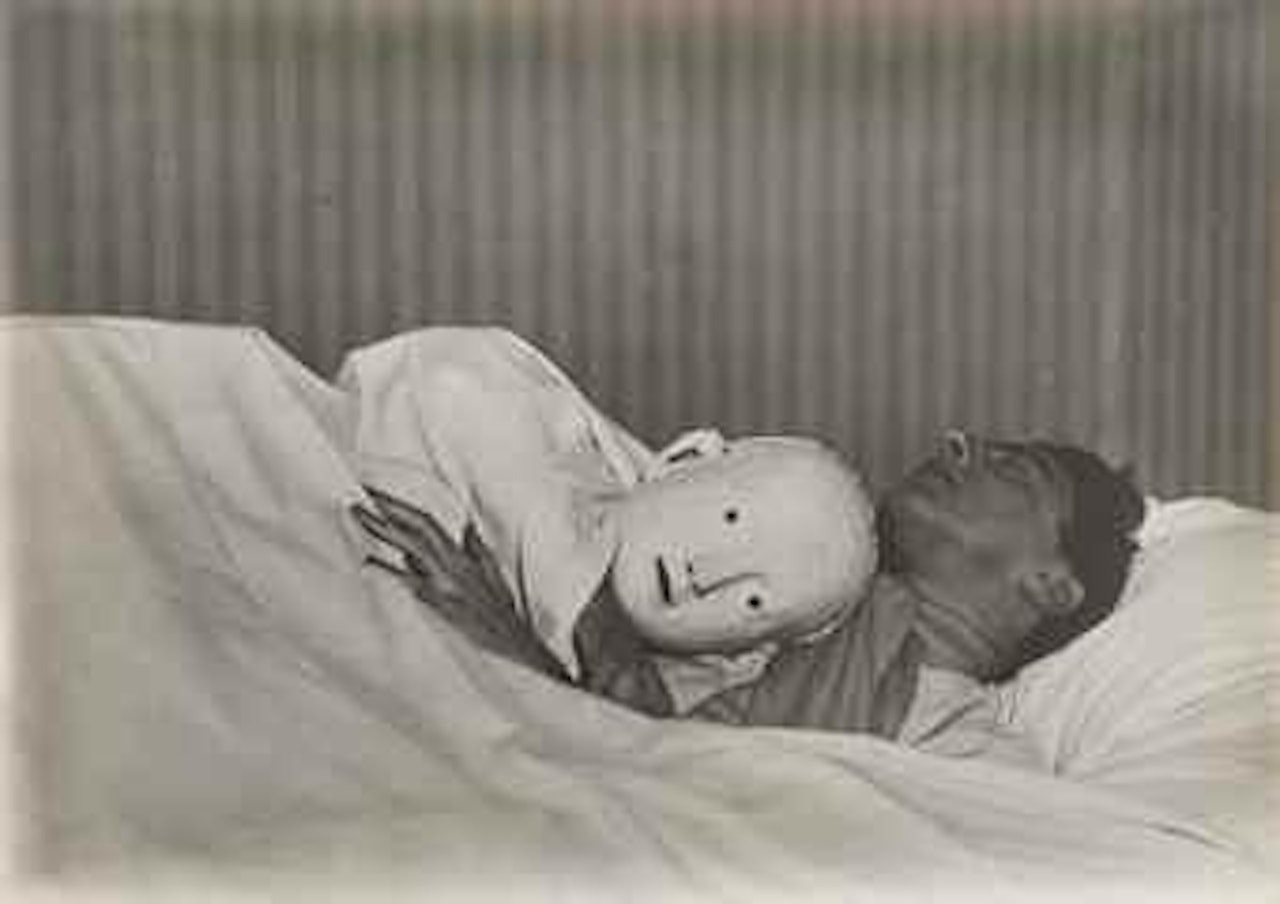 Jean Cocteau couché avec le masque d'Antigone (variante) by Berenice Abbott