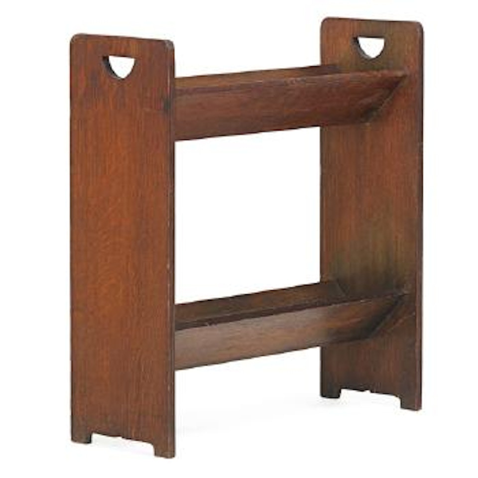 Early double v-trough book rack by Gustav Stickley