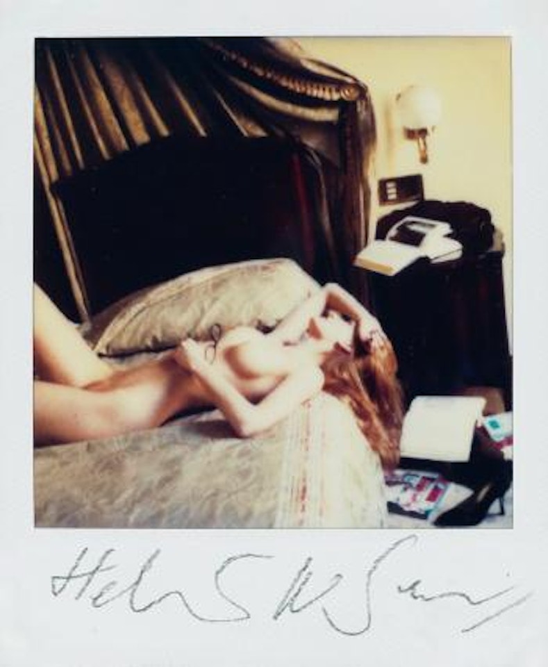 Nude model with glasses on her chest by Helmut Newton