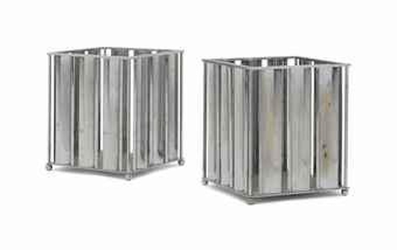 A Near Pair of Wastepaper Baskets by Jacques Adnet