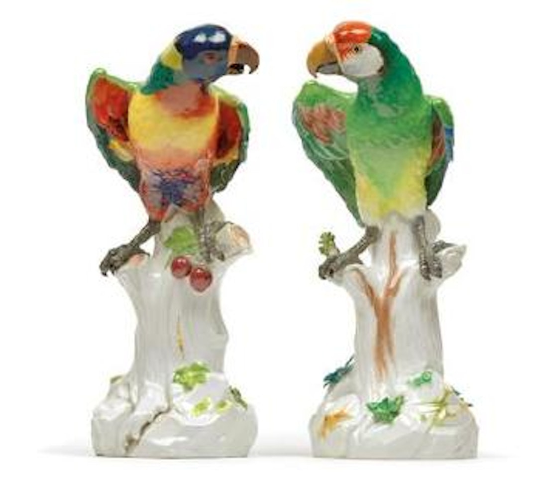 A pair of parrots sitting on a tree trunk by Johann Joachim Kändler