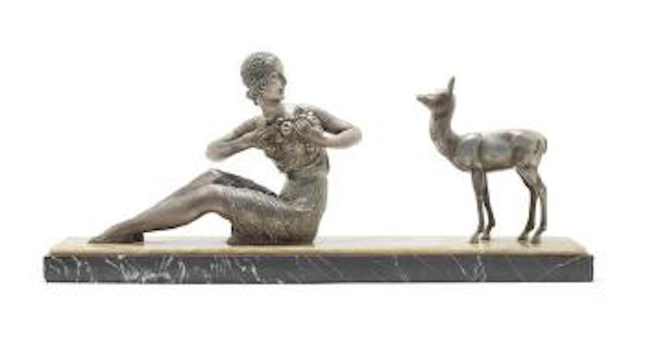 Figural group depicting a seated Woman with Deer by Demetre Chiparus
