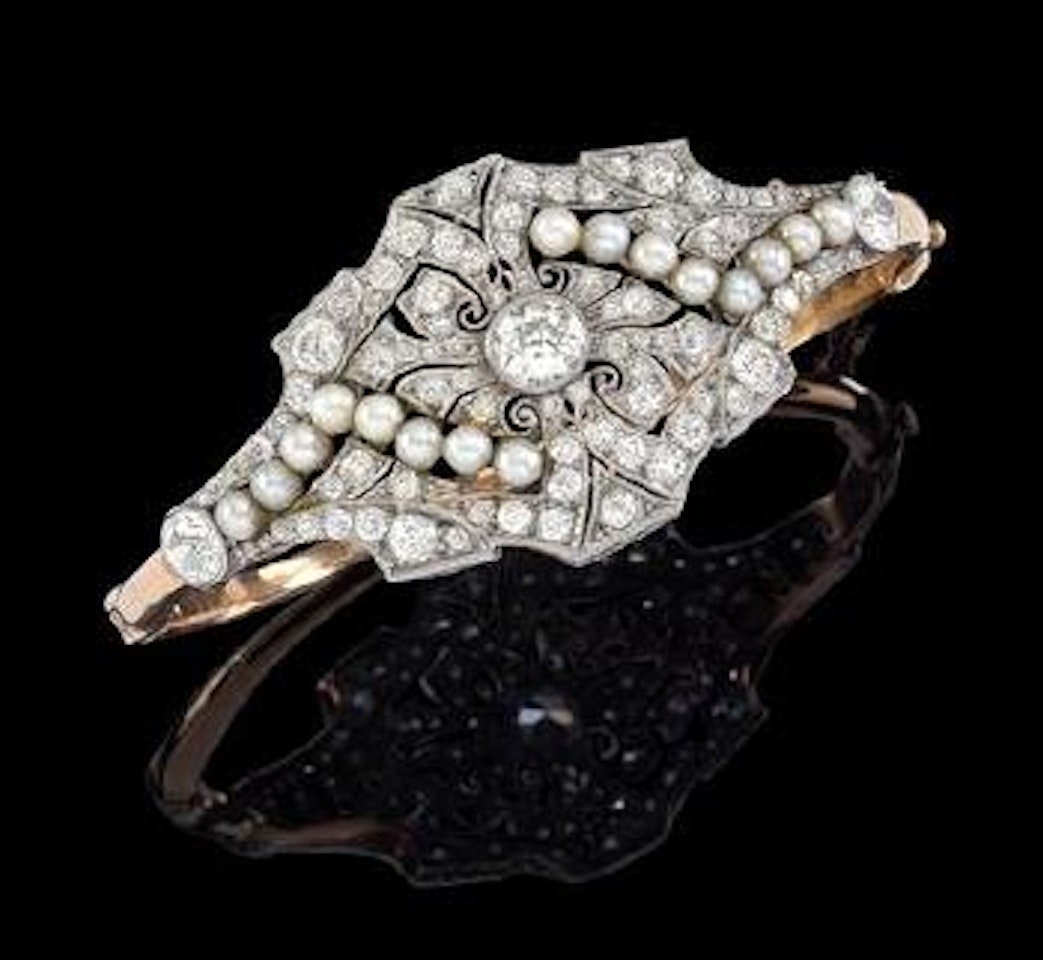 A cultured pearl and diamond bangle by Unknown Jewelry Maker
