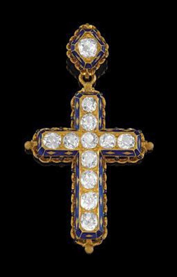A diamond cross pendant by Unknown Jewelry Maker