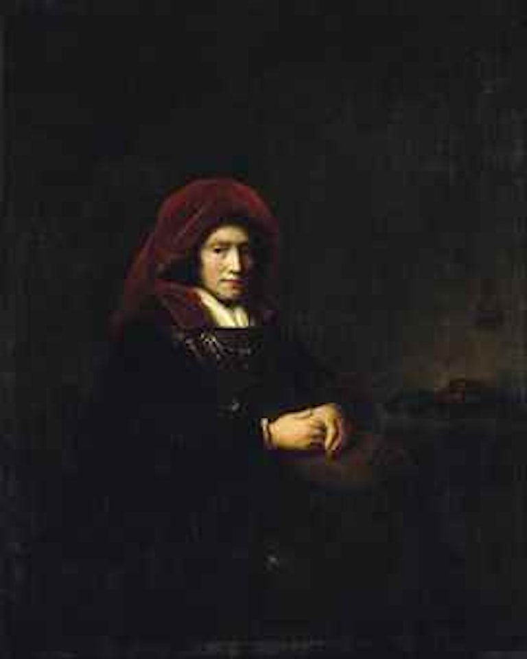 Portrait of a seated woman with a book and spectacles by Attributed to Rembrandt Harmensz van Rijn