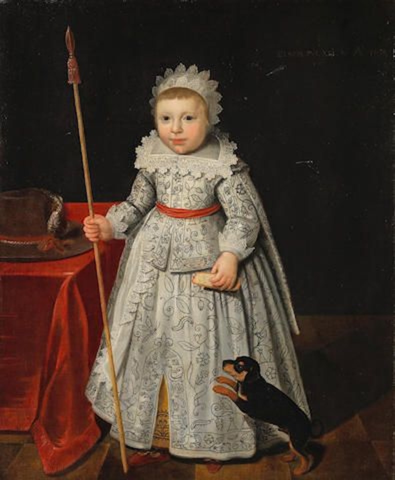 Portrait of a child, full-length, standing, holding a toy lance, with his dog by English School