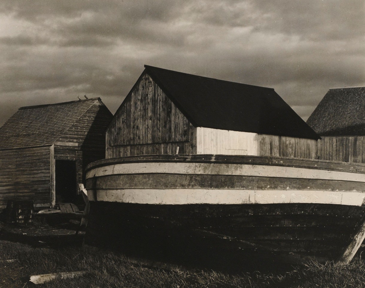 BOAT AND SHEDS, GASPÉ by Paul Strand