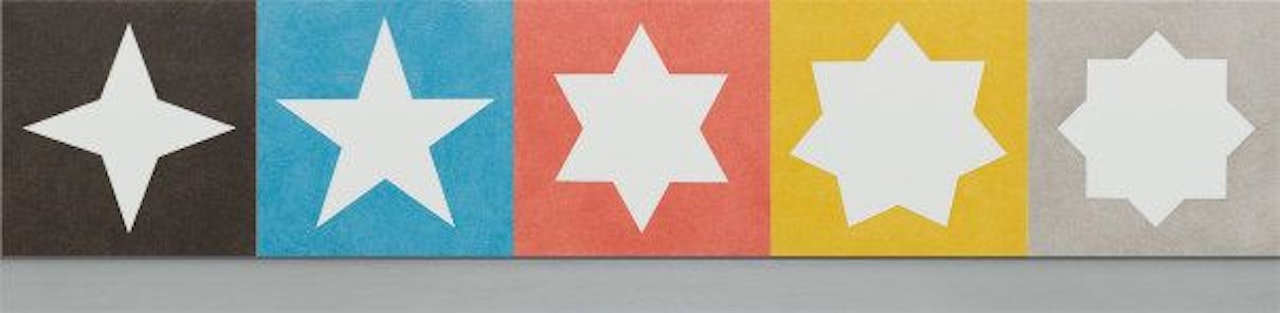 Wall Drawing #408 A-E Stars with four, five, six, seven, and eight points on black, blue, red, yellow, and gray walls, respectively. The stars are the white of the wall by Sol LeWitt